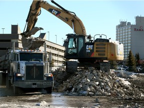 A Caterpillar excavator loads concrete into a dump truck  on the Blatchford on Friday in Edmonton, Alta., on Jan. 29, 2016. The development, on the old Edmonton City Centre grounds, is a development that will transform 217 hectares (536 acres) of land in the heart of the city into an inclusive, family-oriented, sustainable community for up to 30,000 people. Tom Braid