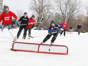 Elizabeth Thebault scores a goal for Team Scotiabank in the CFB Trenton Pond Hockey Classic.