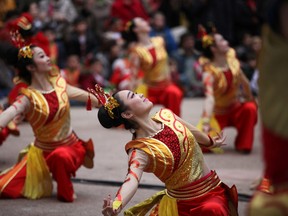 A Chinese dance group performs during celebrations of the Chinese New Year at Lisbon's Estrela park Sunday, Jan. 31, 2016. The Chinese new year, the year of the monkey, starts Feb. 8. There are some twenty thousand Chinese living in Portugal, half of them in Lisbon. (AP Photo/Armando Franca)
