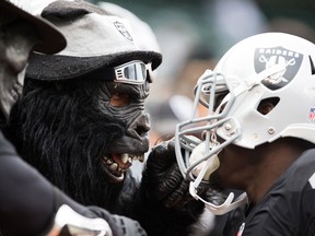 Oakland Raiders fans speak to strong safety Larry Asante (42) before the game against the Green Bay Packers at O.co Coliseum. Kelley L Cox-USA TODAY Sports