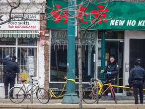 Police at the scene of a multiple shooting in which two people were killed. (DAVE THOMAS, Toronto Sun)