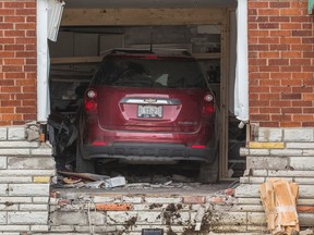 An SUV crashed inside of a house at Hamstead Ave and Chisholm Ave in Toronto, (ERNEST DOROSZUK, Toronto Sun)
