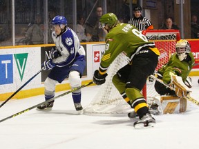 Riley Bruce, of the North Bay Battalion, races Mikkel Aagaard, of the Sudbury Wolves, to the puck during OHL action at Memorial Gardens on Sunday afternoon. The Battalion doubled the Wolves 4-2.