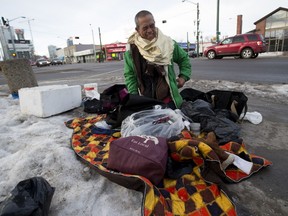 Gregorio Riego gathers his belongings from a downtown street corner on January 28, 2016 in Edmonton. He has been homeless for four years but is hoping to get his own apartment soon, (Greg Southam)