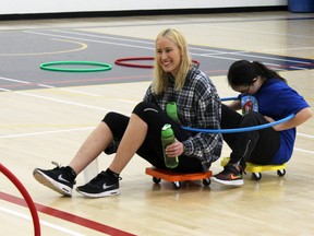Shannen Murray, left, and Ashaya Garrett play during the 26th Annual Winter Adaptive Games at Queen's University's Athletics and Recreation Centre on Saturday. (Steph Crosier/The Whig-Standard)