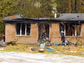 Investigators continued Sunday (Jan. 31, 2016) to sift through the remains of a house destroyed by fire south of LaSalette early Saturday morning. The lone occupant of the home escaped unhurt. DANIEL R. PEARCE/SIMCOE REFORMER