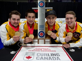 From left, Manitoba’s Matt Dunstone, Colton Lott, Kyle Doering and Rob Gordon hold the trophy after winning the Canadian junior championship in Stratford. (Michael Burns/photo)