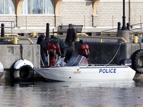 The Ontario Provincial Police Underwater Search and Recovery Unit come back to shore in Kingston on Monday February 1 2016 after recovering the body of a 23-year-old man who fell in Lake Ontario from the Wolfe Islander III ferry on Friday January. 29 2016. The police do not  consider the death suspicious. Elliot Ferguson/The Kingston Whig-Standard/Postmedia Network