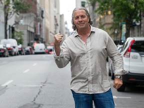 Famous Canadian wrestler Bret Hart poses for the camera on Notre-Dame street in Montreal, Quebec, on Monday July 7 2014, before the Monday Night RAW event to be held at the Bell Center. PHILIPPE-OLIVIER CONTANT
