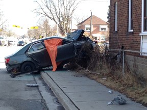 A car crashed into a house at Birmingham and 22nd Sts. in Etobicoke around 10:30 p.m. Monday, Feb. 1, 2016. (Kevin Connor/Toronto Sun)