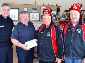 On behalf of the West Perth Fire Department, Fire Chief Bill Hunter (left)and Station Chief Jim Tubb accepted a donation of a Water Jel Burn Kit from ambassador Dave Shearer and member Jim Tubb of the Stratford on Avon Shrine Club. The burn gel is applied by firefighters to people who have been burned to help relieve pain, heal the burns and prevent scarring. This burn kit was one of 13 the Shriners have donated to area fire departments this year, an initiative they have been undertaking since 2012. GALEN SIMMONS/MITCHELL ADVOCATE