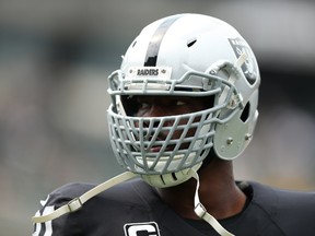 Justin Tuck #91 of the Oakland Raiders warms up prior to playing the Cincinnati Bengals in their NFL season opener game at O.co Coliseum on September 13, 2015 in Oakland, California.   Ezra Shaw/Getty Images/AFP
