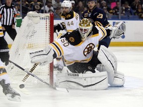 Boston Bruins goalie Jonas Gustavsson clears the puck during action against the Buffalo Sabres at First Niagara Center. (Timothy T. Ludwig/USA TODAY Sports)