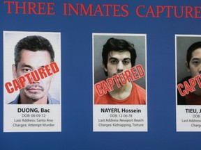 Three inmates captured are seen on a video monitor at Orange County Sheriff's news conference in Santa Ana, Calif., Monday, Feb. 1, 2016. The inmates from left, Bac Duong, 43, Hossein Nayeri, 37, and Jonathan Tieu, 20, who escaped on Jan. 22 from Central Men's Jail in Orange County. Duong turned himself in Friday and the other two were arrested in San Francisco on Saturday. (AP Photo/Nick Ut)