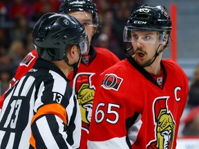 Ottawa Senators defenseman Erik Karlsson (65) argues a call with referee Dan O'Halloran (13) during NHL action in Ottawa, Ont. on Thursday January 21, 2016. Errol McGihon/Ottawa Sun/Postmedia Network