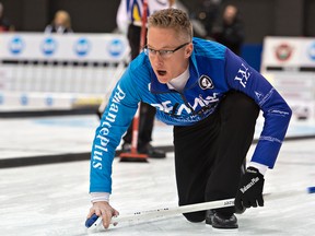 Greg Balsdon of Cataraqui Golf and Curling Club watches his shot during opening-day action at the Ontario Tankard in Brantford on Monday. Balsdon's rink beat Wayne Tuck of Brant 6-5. (Brian Thompson/Postmedia Network)