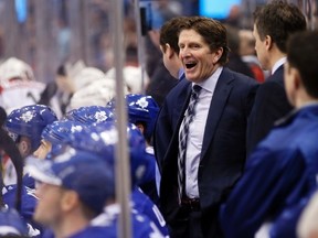 Toronto Maple Leafs head coach Mike Babcock laughs on the bench against the Carolina Hurricanes the at the Air Canada Centre in Toronto on Jan. 21, 2016. (John E. Sokolowski/USA TODAY Sports)