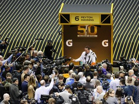 Denver Broncos quarterback Peyton Manning answers questions during Opening Night for Super Bowl 50 festivities in San Jose on Feb. 1, 2016. (AP Photo/Charlie Riedel)