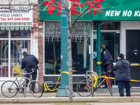 Toronto Police at the scene on Spadina Ave. Sunday, January 31, 2016 after five people were shot, killing two. (Dave Thomas/Toronto Sun)