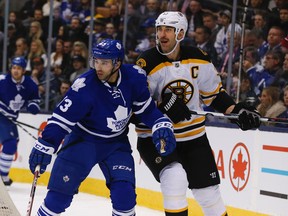 Zdeno Chara of the Boston Bruins (right) stays close to Nazem Kadri of the Toronto Maple Leafs at the Air Canada Centre in Toronto on Nov. 23, 2015. (JACK BOLAND/Toronto Sun files)