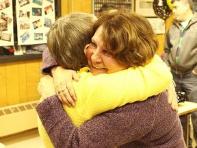 Laura Overholt hugs Lin Steffler at the Seaforth Legion.(Shaun Gregory/Huron Expositor)