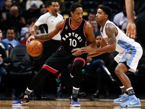 Toronto Raptors guard DeMar DeRozan (10) dribbles the ball while being defended by Denver Nuggets guard Gary Harris (14) in the first quarter Monday at Pepsi Center in Denver. (Isaiah J. Downing/USA TODAY Sports)