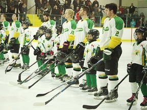 The Seaforth Novice Stars skated with the Centenaires during the warm up and stood with them for the national anthem. (Shaun Gregory/Huron Expositor)