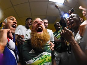 Portland Timbers defender Nat Borchers (7) gets his beard cut in the locker room after the 2015 MLS Cup championship game against the Columbus Crew at MAPFRE Stadium. Mike DiNovo-USA TODAY Sports