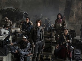 This photo provided by Disney - Lucasfilm shows actors Riz Ahmed, from left, Diego Luna, Felicity Jones, Jiang Wen and Donnie Yen, in the upcoming film, "Star Wars: Rogue One." The film releases Dec. 16, 2016.  (Jonathan Olley, Leah Evans/Disney)