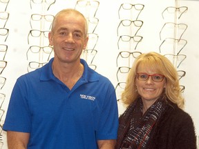 New Vision Optical owner Brad Eggett and long-time employee Deb Brewer are all smiles, as the downtown business is celebrating its 25thanniversary this year.