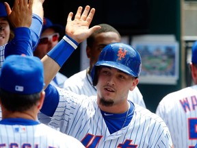 Darrell Ceciliani #1 of the New York Mets celebrates his fourth inning home run against the Atlanta Braves at Citi Field on June 14, 2015 in the Flushing neighborhood of the Queens borough of New York City. The home run was the first in the major leagues for Ceciliani.   Jim McIsaac/Getty Images/AFP