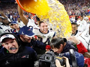 New England Patriots head coach Bill Belichick is dunked with Gatorade after defeating the Seattle Seahawks in Super Bowl XLIX at University of Phoenix Stadium. Mark J. Rebilas-USA TODAY Sports