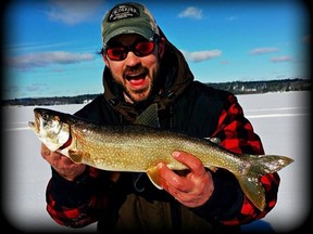 Lively's Scott Haddow shows a lake trout caught recently in a local lake. Living with Lakes Centre director John Gunn said he supports a return of lake trout to Sudbury's Ramsey Lake.