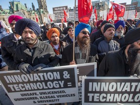 Ottawa cabbies bolstered by others from Toronto, take their anti-Uber protest to Parliament Hill.  Until now they have targeted most of their Uber-related protests at City Hall, since the municipality is the regulator for taxis. The city is reviewing the taxi bylaw to see if alternative ride-sharing services, like Uber, should be rolled into the regulatory system. (Wayne Cuddington)