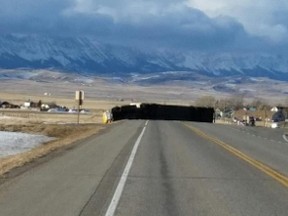 Semi truck blown over by wind gust on Highway 3