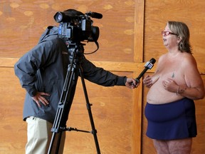 Activist Heidi Lilley is interviewed during a "Free the Nipple" demonstration in Hampton Beach, New Hampshire August 23, 2015. (REUTERS/Brian Snyder)
