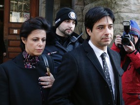 Jian Ghomeshi and his lawyer, Marie Henein, leave Old City Hall court after the second day of his trial on Tuesday, February 2, 2016. (Craig Robertson/Toronto Sun)