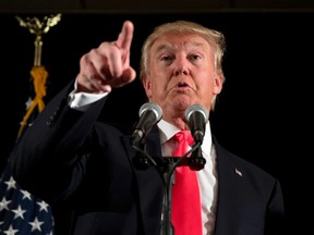 Republican presidential candidate Donald Trump speaks with members of the media during a news conference Tuesday, Feb. 2, 2016, in Milford, N.H. (AP Photo/Matt Rourke)