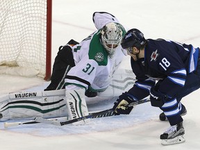 Dallas Stars goalie Antti Niemi (l) blocks a shot by Winnipeg Jets center Bryan Little during NHL hockey in Winnipeg, Man. Tuesday February 02, 2016.
Brian Donogh/Winnipeg Sun/Postmedia Network