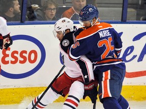 Darnell Nurse runs into Rene Bourque during first period action Tuesday at Rexall Place. (Dan Riedlhubr)