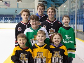 The Sarnia Legionnaires will celebrate 'Hockey Day in Sarnia' with a number of festivities this Saturday. Shown helping to promote the event are, in the front row, minor hockey players Carter Fawcett (left), Wyatt Healey and Ruby Frew. Middle row: Cole Healey (left) and Logan Healey. Back row: Legionnaires Brandon Layman (left), Eric Marsh and Brenden Shegena. (Anne Tigwell photo)