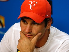 Roger Federer of Switzerland answers questions at a press conference following his semifinal loss to to Novak Djokovic of Serbia at the Australian Open in Melbourne on Jan. 28, 2016. (AP Photo/Vincent Thian)