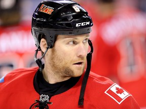 Flames defenceman Dennis Wideman was suspended 20 games without pay Wednesday for his crosscheck to linesman Don Henderson last week. (Al Charest/Postmedia Network)