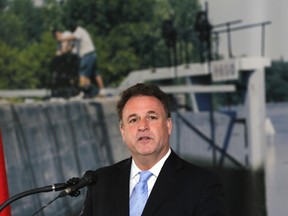 MP Gord Brown has been a champion of the Rideau Canal during his tenure, seen here announcing extended hours to its operation in 2014. Now Brown is hoping the Liberal government will honour his committment on infrastructure spending earmarked in 2015 for the canal and Thousand Islands National Park. (Postmedia Network file photo)
