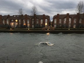 A car is submerged in water after being driven into the waters in Elevator Bay along King Street West on Wednesday evening. (Courtesy of Kingston Police)