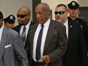 Actor and comedian Bill Cosby holds onto his security team member as he uses a cane upon returning after a lunch break at the Montgomery County Courthouse in Norristown, Pennsylvania February 3, 2016. A lawyer for Bill Cosby said on Wednesday that he never would have allowed the comedian to give a deposition in a civil lawsuit brought by a woman accusing him of rape if he knew his client's words could be used for a criminal prosecution. REUTERS/Michael Bryant/Pool