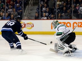 Winnipeg Jets' Bryan Little (18) misses on a breakaway opportunity in front of Dallas Stars goaltender Antti Niemi (31) during second period NHL hockey action in Winnipeg, Tuesday, February 2, 2016. THE CANADIAN PRESS/Trevor Hagan