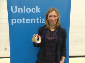 Beckie Scott poses with her medals at Cold Lake High School in Cold Lake, Alta., on Oct. 8, 2015. Scott is battling as hard as ever for the sanctity of sport by rooting out athletes who cheat. (Celina Ip/Postmedia Network)