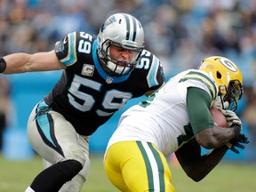 In this Nov. 8, 2015, file photo, Carolina Panthers linebacker Luke Kuechly (59) moves in to to tackle Green Bay Packers running back James Starks in Charlotte, N.C. (AP Photo/Bob Leverone, File)