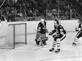 Toronto Maple Leafs captain Darryl Sittler (left) scores his record setting 10th point in one game against goaltender Dave Reece and the Boston Bruins in Toronto on Feb. 7, 1976. (Barry Gray/Toronto Sun/Files)